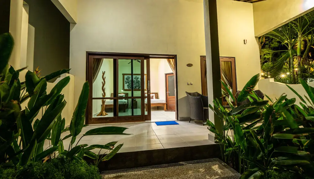 Luxury bungalow terrace at Ocean Sun Dive Resort Tulamben with tropical plants and modern interior